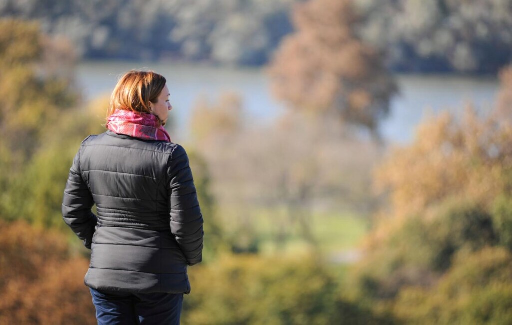 Midlife woman reflecting on body changes, stress, and wellness